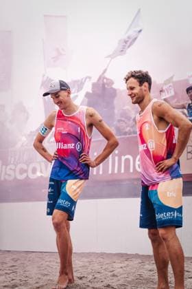 Beach volleyball men Allianz German Beach Tour 2024 Tourstop Kühlungsborn 2 18 08 2024 front Eric Stadie left and Momme Lorenz right back Pyrotechnics from the faction Bräune Kühlungsborn beach at the pier Mecklenburg Vorpommern Germany