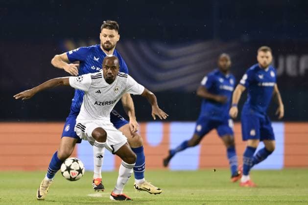 GNK Dinamo Zagreb v Qarabag - UEFA Champions Qualifying Play-Off: First Leg ZAGREB, CROATIA - AUGUST 20: Julio Romao of Qarabag and Bruno Petkovic of Dinamo Zagreb in action during the UEFA Champions Qualifying Play-Off First Leg match between GNK Dinamo Zagreb and Qarabag at Stadion Maksimir on August 20, 2024 in Zagreb, Croatia.  JosipxRegovic PIXSELL