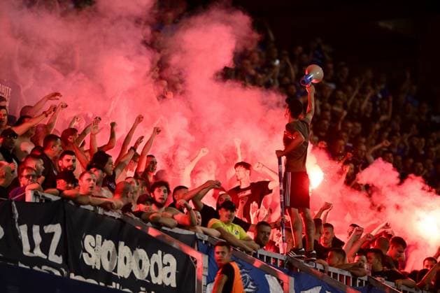 GNK Dinamo Zagreb v Qarabag - UEFA Champions Qualifying Play-Off: First Leg ZAGREB, CROATIA - AUGUST 20: Dinamo Zagreb Fans, Bad Blue Boys (BBB) lit flares on the stands during the UEFA Champions Qualifying Play-Off First Leg match between GNK Dinamo Zagreb and Qarabag at Stadion Maksimir on August 20, 2024 in Zagreb, Croatia.  JosipxRegovic PIXSELL