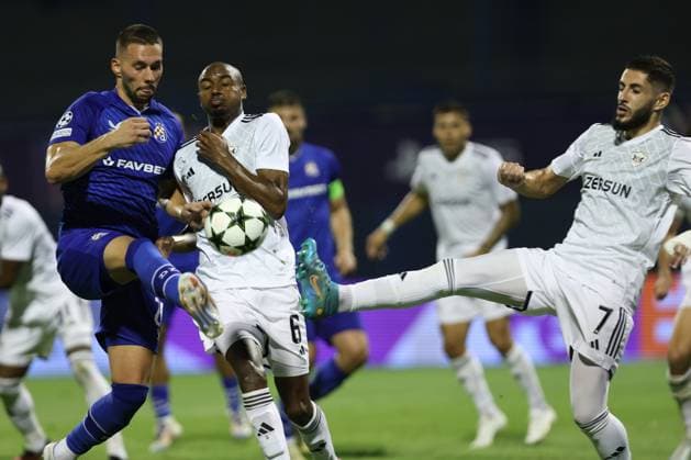 Zagreb, 20.08.2024. - Stadion Maksimir, UEFA CHAMPIONS LEAGUE - 2024 25 Play-offs 1st leg - GNK Dinamo (blue) - QarabaÄü FK (white) 3:0 Marko Pjaca (20) vs Julio Romao (6) and Yassine Benzia (7) 