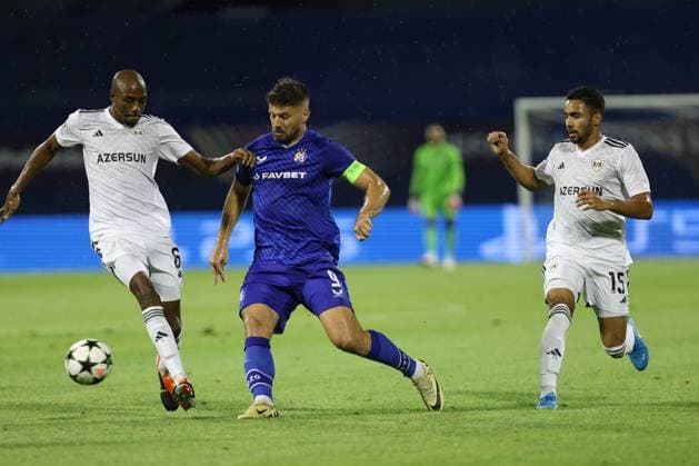 Zagreb, 20.08.2024. - Stadion Maksimir, UEFA CHAMPIONS LEAGUE - 2024 25 Play-offs 1st leg - GNK Dinamo (blue) - QarabaÄü FK (white) 3:0 Bruno Petkovic (C-9) vs Julio Romao (6) and Leandro Andrade (15) 