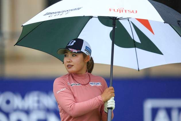 21st August 2024; Old Course at St Andrews, St Andrews, Fife, Scotland; AIG Womens Open Golf, Practice Day 3; Ayaka Furue of Japan shelters from the rain under an umbrella on the first tee of the Old Course, St Andrews Links during a practice round at the AIG Women& x2019;s Open  ActionPlus12683683 DavidxYoung