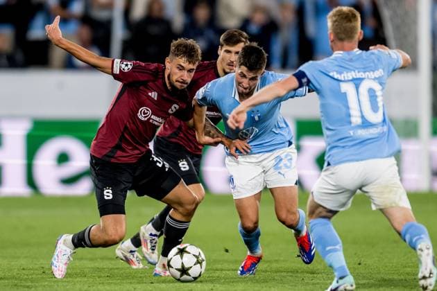 240821 Matej Rynes of Sparta Prague and Lasse Berg Johnsen of Malmö FF during the UEFA Champions League football match between Malmö FF and Sparta Prague on August 21, 2024 in Malmö Photo Christoffer Borg Mattisson BILDBYRAN COP 261 CO0456 fotboll football soccer fotball champions league malmö ff sparta prag bbeng play off  Copyright: CHRISTOFFERxBORGxMATTISSON BB240821CB053