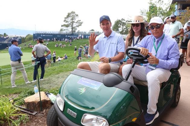 CASTLE ROCK, CO - AUGUST 21: NFL, American Football Herren, USA Hall of Fame quarterback Peyton Manning leaves on a golf cart with his wife Ashley Manning after finishing on the 18th hole during the PGA, Golf Herren FedExCup BMW Championship Pro Am on August 21st, 2024, at Castle Pines Golf Club in Castle Rock, Colorado. (Photo by Brian Spurlock Icon Sportswire) GOLF: AUG 21 PGA FedExCup Playoffs - BMW Championship Pro Am EDITORIAL USE ONLY Icon24082114