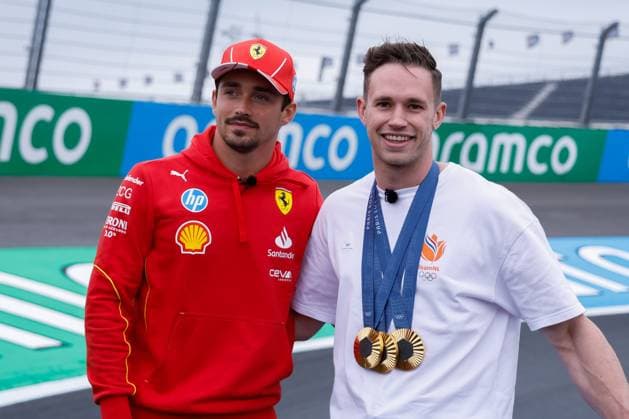 Harry Lavreysen dutch olympic champion track cyclist on his golden bike shows his three golden medals and Charles Leclerc of Monaco and Scuderia Ferrari during previews ahead of the F1 Grand Prix of Netherlands at Circuit Park Zandvoort on August 22, 2024 in Zandvoort, Netherlands Defodi 704 MTB20240822F1ZandvoortDag1352580 Defodi-704
