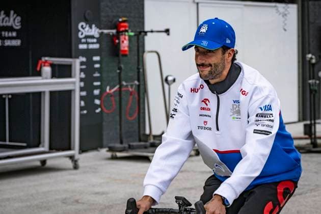 22nd August 2024; Circuit Zandvoort, Zandvoort, Holland, North Holland, Netherlands; Formula 1 Heineken Dutch Grand Prix 2024; Arrivals and Inspection Day; Daniel Ricciardo (AUS) of Visa Cash App RB cycles away from the garage  ActionPlus12683992 GodfreyxPitt