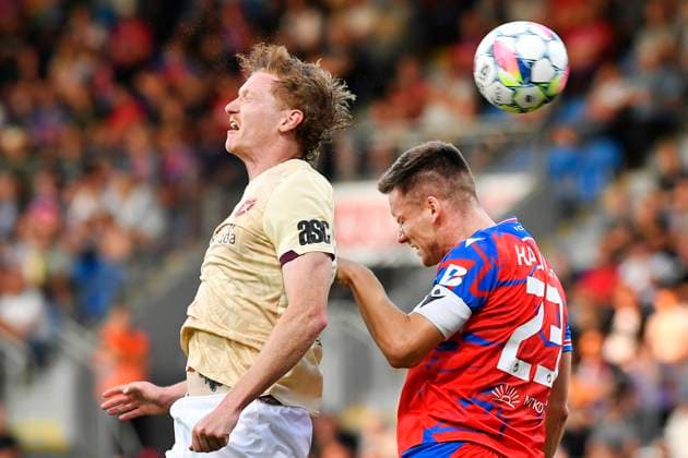 Kye Rowles of Heart, left, and Lukas Kalvach of Plzen in action during the football European League 4th qualifying round opening match Viktoria Plzen vs Heart of Midlothian in Pilsen, Czech Republic, August 22, 2024. (CTKxPhoto MiroslavxChaloupka) CTKPhotoP2024082207563  CTKPhotoP2024082207563