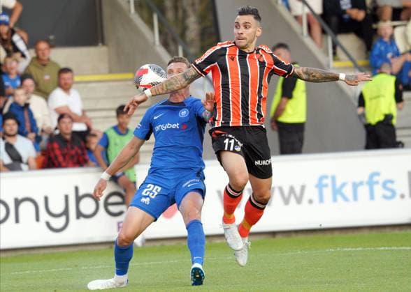22.08.2024, Riga, Latvia. Latvia™s RFS Petr Mares (left) vies for the ball with Cyprus™ APOEL Anastasios Donis during their UEFA Europa League play offs game between RFS (Latvia) and APOEL (Cyprus). Foto: Roman Koksarov Riga Latvia Copyright: xRomÄnsxKokÅ¡arovsx soc_RFS-APOEL20240822rk227.JPG