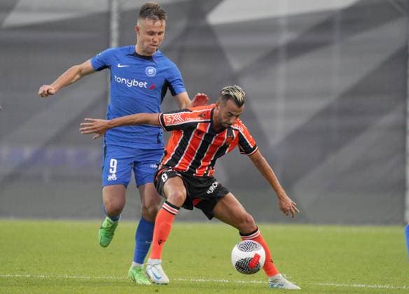 22.08.2024, Riga, Latvia. Latvia™s RFS Janis Ikaunieks (left) vies for the ball with Cyprus™ APOEL Sergio Tejera during their UEFA Europa League play offs game between RFS (Latvia) and APOEL (Cyprus). Foto: Roman Koksarov Riga Latvia Copyright: xRomÄnsxKokÅ¡arovsx soc_RFS-APOEL20240822rk403.JPG