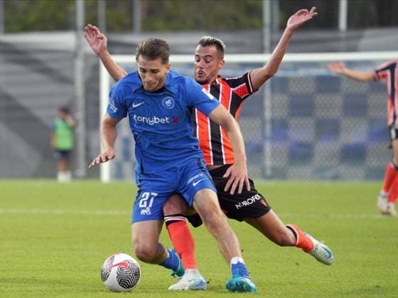 22.08.2024, Riga, Latvia. Latvia™s RFS Adam Marhiev (left) vies for the ball with Cyprus™ APOEL Sergio Tejera during their UEFA Europa League play offs game between RFS (Latvia) and APOEL (Cyprus). Foto: Roman Koksarov Riga Latvia Copyright: xRomÄnsxKokÅ¡arovsx soc_RFS-APOEL20240822rk438.JPG