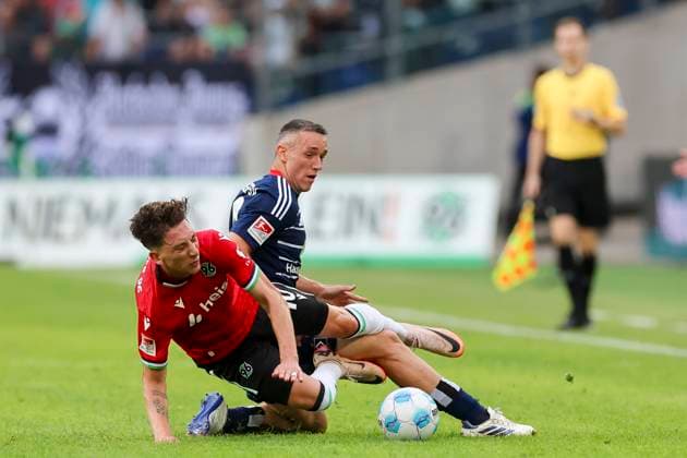 Silvan Hefti Hamburger SV and Jannik Rochelt Hannover 96 battle for the ball, 2 Bundesliga, Hannover 96 vs Hamburger SV, Heinz von Heiden Arena, August 23, 2024 in Hanover, Germany Photo by Marco Steinbrenner DeFodi Images Silvan Hefti Hamburger SV and Jannik Rochelt Hannover 96 battle for the ball, 2 Bundesliga, Hannover 96 vs Hamburger SV, Heinz von Heiden Arena, August 23, 2024 in Hanover, Germany Photo by Marco Steinbrenner DeFodi Images DFB DFL REGULATIONS PROHIBIT ANY USE OF PHOTOGRAPHS AS IMAGE SEQUENCES AND OR QUASI VIDEO Defodi 700 han hsv 20240823 035 Defodi-700 DFB DFL REGULATIONS PROHIBIT ANY USE OF PHOTOGRAPHS AS IMAGE SEQUENCES AND OR QUASI-VIDEO.