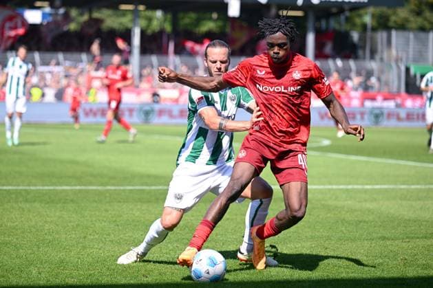 24 08 2024, Football, 2 Bundesliga, Matchday 3 Season 2024 2025, Preußen Münster 1 FC Kaiserslautern, Jorrit Hendrix SC Preussen Münster , Dickson Abiama 1 FC Kaiserslautern xRHR PHOTO TKx Copyright: RHR-FOTOx RHR-FOTO TK