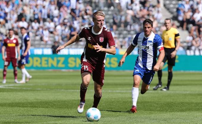 Sebastian Ernst, Diego Demme duel Match scene Action Sport Soccer Football DFL 2 Bundesliga Men 3 Matchday Season 2024 2025 24 08 2024 Hertha BSC Berlin vs SSV Jahn Regensburg DFL regulations prohibit any use of photographs as image sequences and or quasi video