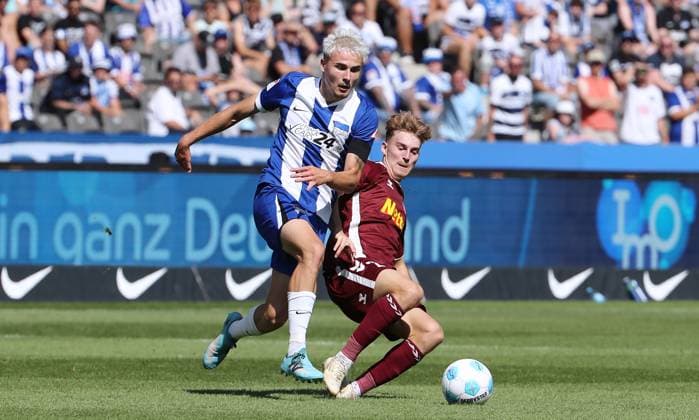 Marten Winkler in a duel with Dominik Kother Match scene Action Sport Football Soccer DFL 2 Bundesliga Men 3 Matchday Season 2024 2025 24 08 2024 Hertha BSC Berlin vs SSV Jahn Regensburg DFL regulations prohibit any use of photographs as image sequences and or quasi video