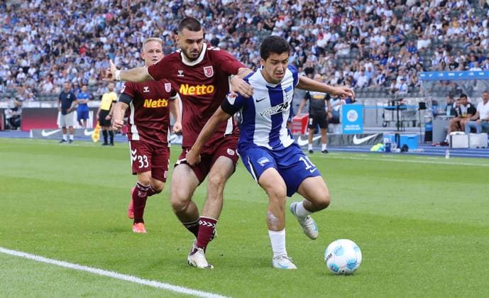 Rasim Bulic in a duel with Ibrahim Maza Match scene Action Sport Football Soccer DFL 2 Bundesliga Men 3 Matchday Season 2024 2025 24 08 2024 Hertha BSC Berlin vs SSV Jahn Regensburg DFL regulations prohibit any use of photographs as image sequences and or quasi video