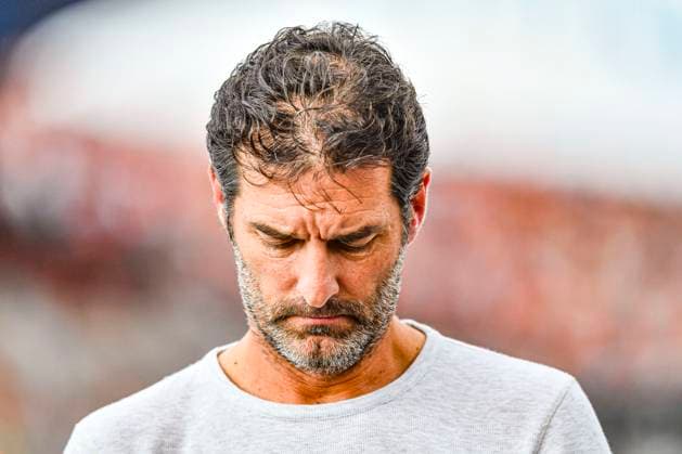 24th August 2024; Circuit Zandvoort, Zandvoort, North Holland, Netherlands; Formula 1 Heineken Dutch Grand Prix 2024; Qualifying Day; Former Oracle Red Bull Racing driver Mark Webber is engrossed with his phone as he walks from the pits  ActionPlus12685466 GodfreyxPitt