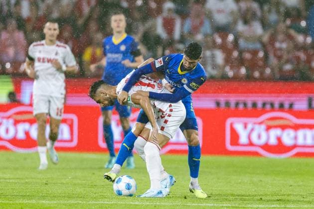 Soccer 2 Liga 1 FC Köln Eintracht Braunschweig on 24 08 2024 at RheinEnergieStadion in Cologne Leart Pacarada Köln , front Fabio Kaufmann Braunschweig , back DFB regulations prohibit any use of photographs as image sequences and or quasi video xJRx