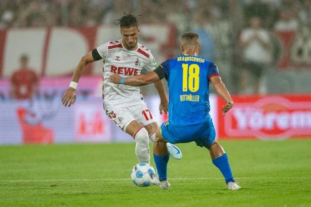 24 08 2024, Soccer 2 Bundesliga, Season 2024 2025, Matchday 03, 1 FC Koeln vs Eintracht Braunschweig at Rhein Energie Stadium in Koeln duel between Leart Pacarada 1 FC Koeln, 17 and Marvin Rittmueller Eintracht Braunschweig, 18 Important note In accordance with the regulations of the DFL German Football League and the DFB German Football Association, it is prohibited to utilize or have utilized photographs taken in the stadium and or of the match in the form of sequential images and or video-like photo series Foto Kirchner Media TH Copyright: xKirchner-Media THx