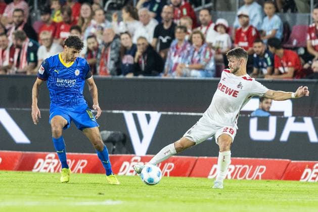Soccer 2 Liga 1 FC Köln Eintracht Braunschweig on 24 08 2024 at RheinEnergieStadion in Cologne Johan Gomez Braunschweig , left Jan Thielmann Köln , right DFB regulations prohibit any use of photographs as image sequences and or quasi video xJRx