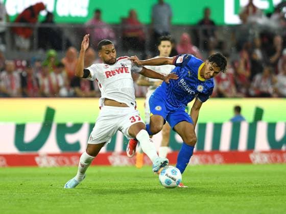 24 08 2024, Cologne, Germany, Rhein Energie Stadium, 1 FC Koeln vs Eintracht Braunschweig 2 Bundesliga, Linton Maina 1 FC Koeln and Johan Gomez Eintracht Braunschweig in a duel Photo Ralf Treese DFB DFL REGULATIONS PROHIBIT ANY USE OF PHOTOGRAPHS AS IMAGE SEQUENCES AND OR QUASI VIDEO Cologne Rhein Energie Stadium North Rhine Westphalia Germany 521_KOEBRA20240824_027 Treese-521