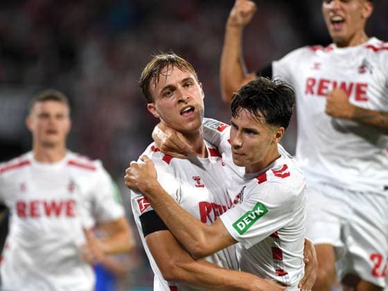 24 08 2024, Cologne, Germany, Rhein Energie Stadium, 1 FC Koeln vs Eintracht Braunschweig 2 Bundesliga, Timo Huebers 1 FC Koeln goal celebration, cheers with his team after scoring 1 0 Photo Ralf Treese DFB DFL REGULATIONS PROHIBIT ANY USE OF PHOTOGRAPHS AS IMAGE SEQUENCES AND OR QUASI VIDEO Cologne Rhein Energie Stadium North Rhine Westphalia Germany 521_KOEBRA20240824_038 Treese-521