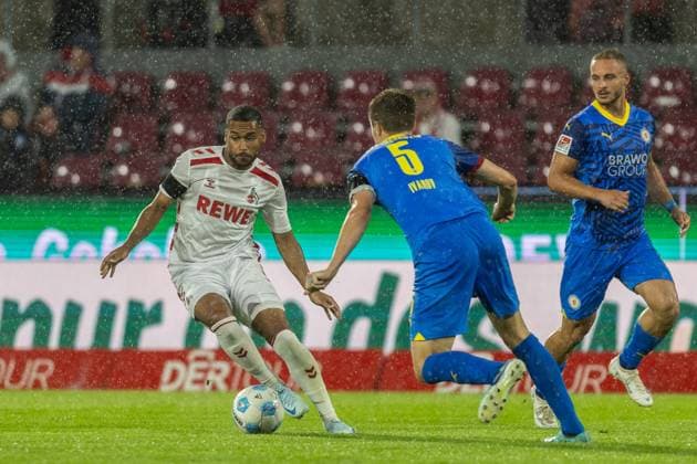 Soccer 2 Liga 1 FC Köln Eintracht Braunschweig on 24 08 2024 at RheinEnergieStadion in Köln Damion Downs Köln , left Robert Ivanov Braunschweig , right DFB regulations prohibit any use of photographs as image sequences and or quasi video xJRx