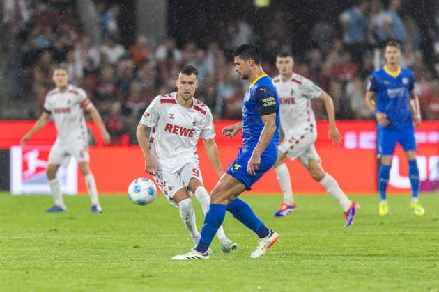 Soccer 2 Liga 1 FC Köln Eintracht Braunschweig on 24 08 2024 at RheinEnergieStadion in Cologne Luca Waldschmidt Köln , left Jannis Nikolaou Braunschweig , right DFB regulations prohibit any use of photographs as image sequences and or quasi video xJRx