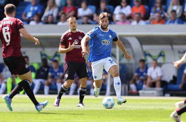 25 08 2024, xdcx, Soccer 2 Bundesliga, SV Darmstadt 98 1 FC Nürnberg, emonline, emspor, despor, v l , Julian Justvan 1 FC Nürnberg , Killian Corredor SV Darmstadt 98 DFL DFB REGULATIONS PROHIBIT ANY USE OF PHOTOGRAPHS AS IMAGE SEQUENCES AND OR QUASI VIDEO Copyright: HMBxMedia Claus