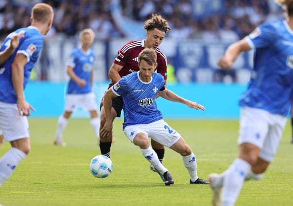 25 08 2024, xdcx, Soccer 2 Bundesliga, SV Darmstadt 98 1 FC Nürnberg, emonline, emspor, despor, v l , Rafael Lubach 1 FC Nürnberg , Matthias Bader SV Darmstadt 98 DFL DFB REGULATIONS PROHIBIT ANY USE OF PHOTOGRAPHS AS IMAGE SEQUENCES AND OR QUASI VIDEO Copyright: HMBxMedia Claus