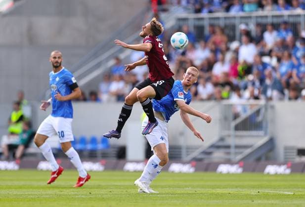 25 08 2024, xdcx, Soccer 2 Bundesliga, SV Darmstadt 98 1 FC Nürnberg, emonline, emspor, despor, v l , Lukas Schleimer 1 FC Nürnberg , Kai Klefisch SV Darmstadt 98 DFL DFB REGULATIONS PROHIBIT ANY USE OF PHOTOGRAPHS AS IMAGE SEQUENCES AND OR QUASI VIDEO Copyright: HMBxMedia Claus
