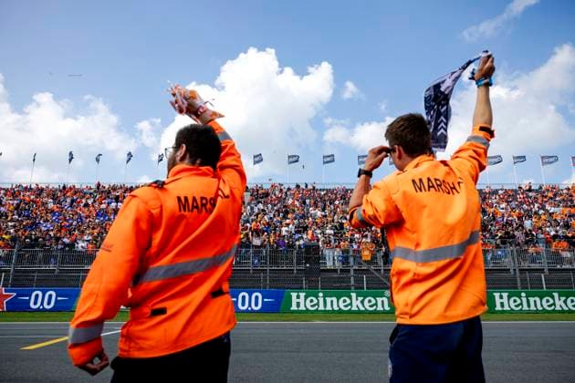 ZANDVOORT - Marshalls wave to the public during the drivers parade of the F1 Grand Prix of the Netherlands at the Circuit of Zandvoort. ANP SEM VAN DER WAL xVIxANPxSportx xxANPxIVx 506715726 originalFilename: 506715726.jpg