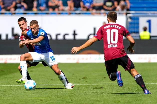 Fabian Nuernberger SV Darmstadt 98, 15 in duel with Oliver Villadsen 1 FC Nuernberg, 02 , before Julian Justvan 1 FC Nuernberg, 10 , GER, SV Darmstadt 98 vs 1 FC Nuernberg, Soccer, 2 Bundesliga, Matchday 3, Season 2024 2025, 25 08 2024 DFL REGULATIONS PROHIBIT ANY USE OF PHOTOGRAPHS as IMAGE SEQUENCES and or QUASI VIDEO GER, SV Darmstadt 98 vs 1 FC Nuernberg Football, 2 Bundesliga, Matchday 3, Season 2024 2025, 25 08 2024 Darmstadt Copyright: xEibner-Pressefoto FlorianxWieganx EP_FWD