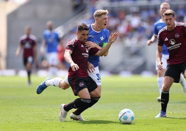 25 08 2024, xdcx, Soccer 2 Bundesliga, SV Darmstadt 98 1 FC Nürnberg, emonline, emspor, despor, v l , Danilo Soares 1 FC Nürnberg , Clemens Riedel SV Darmstadt 98 DFL DFB REGULATIONS PROHIBIT ANY USE OF PHOTOGRAPHS AS IMAGE SEQUENCES AND OR QUASI VIDEO Copyright: HMBxMedia Claus