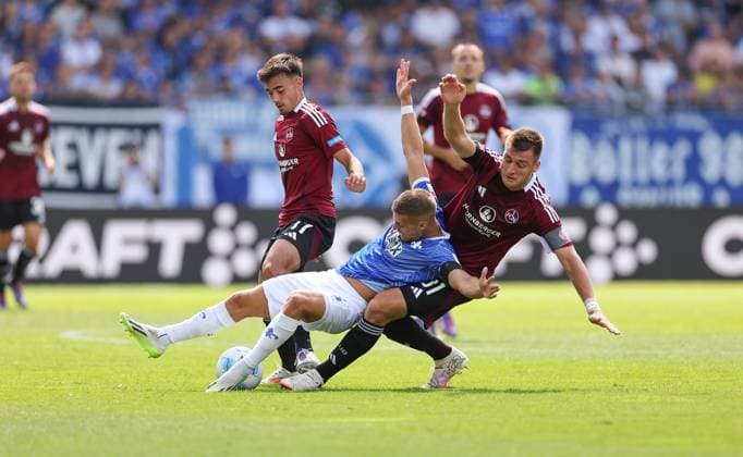 25 08 2024, xdcx, Soccer 2 Bundesliga, SV Darmstadt 98 1 FC Nürnberg, emonline, emspor, despor, v l , Jens Castrop 1 FC Nürnberg , Fabian Nürnberger SV Darmstadt 98 , Robin Knoche 1 FC Nürnberg DFL DFB REGULATIONS PROHIBIT ANY USE OF PHOTOGRAPHS AS IMAGE SEQUENCES AND OR QUASI VIDEO Copyright: HMBxMedia Claus