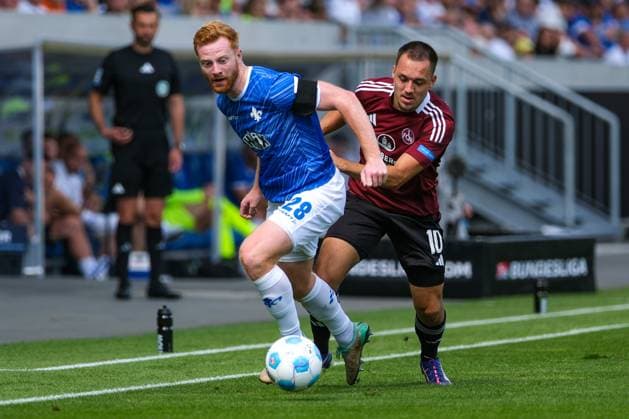 Paul Will SV Darmstadt 98, 28 in duel with Julian Justvan 1 FC Nuernberg, 10 , GER, SV Darmstadt 98 vs 1 FC Nuernberg, Football, 2 Bundesliga, Matchday 3, Season 2024 2025, 25 08 2024 DFL REGULATIONS PROHIBIT ANY USE OF PHOTOGRAPHS as IMAGE SEQUENCES and or QUASI VIDEO GER, SV Darmstadt 98 vs 1 FC Nuernberg Football, 2 Bundesliga, Matchday 3, Season 2024 2025, 25 08 2024 Darmstadt Copyright: xEibner-Pressefoto FlorianxWieganx EP_FWD