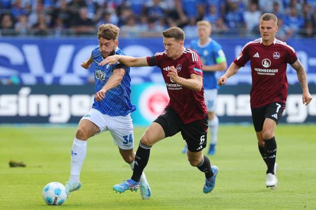 25 08 2024, xtvx, Fußball 2 Bundesliga, SV Darmstadt 98 1 FC Nürnberg emspor, v l Zweikampf, Duell, duel, tackle, compete d34 Florian Flick 1 FC Nuernberg DFL DFB REGULATIONS PROHIBIT ANY USE OF PHOTOGRAPHS as IMAGE SEQUENCES and or QUASI VIDEO Darmstadt