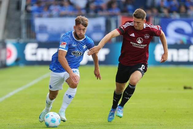 25 08 2024, xtvx, Fußball 2 Bundesliga, SV Darmstadt 98 1 FC Nürnberg emspor, v l Zweikampf, Duell, duel, tackle, compete d34 Florian Flick 1 FC Nuernberg DFL DFB REGULATIONS PROHIBIT ANY USE OF PHOTOGRAPHS as IMAGE SEQUENCES and or QUASI VIDEO Darmstadt