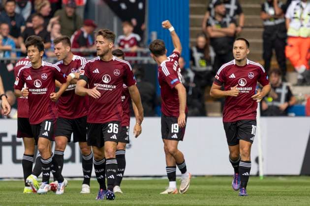 2 Soccer Bundesliga SV Darmstadt 98 1 FC Nuremberg, 25 08 2024 Michal Sevcik 1 FC Nuremberg 19 with his clenched fist towards his own fans after scoring the goal to make it 1 1, Lukas Schleimer 1 FC Nuremberg 36 Kanji Okunuki 1 FC Nuremberg 11 Robin Knoche 1 FC Nuremberg 31 Julian Justvan 1 FC Nuremberg 10 , SV Darmstadt 98 1 FC Nuremberg, Darmstadt, MERCK Stadion, 25 8 2024 Copyright: xBEAUTIFULxSPORTS Gawlikx