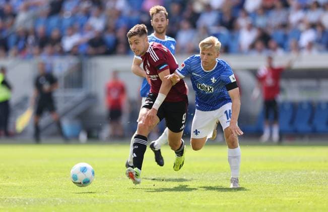 25 08 2024, xdcx, Soccer 2 Bundesliga, SV Darmstadt 98 1 FC Nürnberg, emonline, emspor, despor, v l , Stefanos Tzimas 1 FC Nürnberg , Andreas Müller SV Darmstadt 98 DFL DFB REGULATIONS PROHIBIT ANY USE OF PHOTOGRAPHS AS IMAGE SEQUENCES AND OR QUASI VIDEO Copyright: HMBxMedia Claus