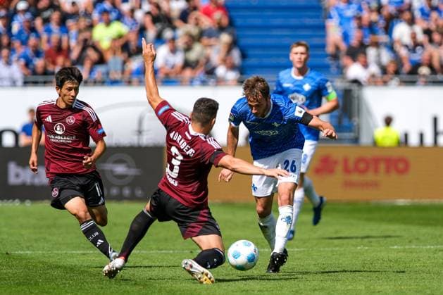 Matthias Bader SV Darmstadt 98, 26 in duel with Danilo Soares 1 FC Nuernberg, 03 , behind Kanji Okunuki 1 FC Nuernberg, 11 , GER, SV Darmstadt 98 vs 1 FC Nuernberg, Soccer, 2 Bundesliga, Matchday 3, Season 2024 2025, 25 08 2024 DFL REGULATIONS PROHIBIT ANY USE OF PHOTOGRAPHS as IMAGE SEQUENCES and or QUASI VIDEO GER, SV Darmstadt 98 vs 1 FC Nuernberg Football, 2 Bundesliga, Matchday 3, Season 2024 2025, 25 08 2024 Darmstadt Copyright: xEibner-Pressefoto FlorianxWieganx EP_FWD