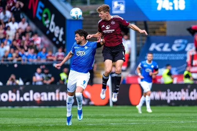 Fraser Hornby SV Darmstadt 98, 09 in duel with Finn Jeltsch 1 FC Nuernberg, 04 , GER, SV Darmstadt 98 vs 1 FC Nuernberg, Football, 2 Bundesliga, Matchday 3, Season 2024 2025, 25 08 2024 DFL REGULATIONS PROHIBIT ANY USE OF PHOTOGRAPHS as IMAGE SEQUENCES and or QUASI VIDEO GER, SV Darmstadt 98 vs 1 FC Nuernberg Football, 2 Bundesliga, Matchday 3, Season 2024 2025, 25 08 2024 Darmstadt Copyright: xEibner-Pressefoto FlorianxWieganx EP_FWD