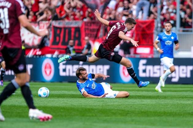 Killian Corredor SV Darmstadt 98, 34 in duel with Florian Flick 1 FC Nuernberg, 06 , GER, SV Darmstadt 98 vs 1 FC Nuernberg, Soccer, 2 Bundesliga, Matchday 3, Season 2024 2025, 25 08 2024 DFL REGULATIONS PROHIBIT ANY USE OF PHOTOGRAPHS as IMAGE SEQUENCES and or QUASI VIDEO GER, SV Darmstadt 98 vs 1 FC Nuernberg Soccer, 2 Bundesliga, Matchday 3, Season 2024 2025, 25 08 2024 Darmstadt Copyright: xEibner-Pressefoto FlorianxWieganx EP_FWD