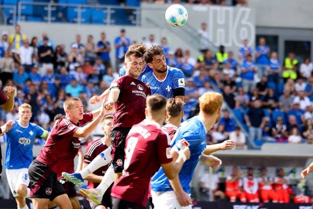 2024 08 25 xJFAx Football 2 Bundesliga 3 Matchday Season 2024 25, SV Darmstadt 98 1 FC Nürnberg v l , Robin Knoche 1 FC Nürnberg , Fraser Hornby SV Darmstadt 98 header, header duel DFL DFB REGULATIONS PROHIBIT ANY USE OF PHOTOGRAPHS as IMAGE SEQUENCES and or QUASI VIDEO Copyright: JoaquimxFerreira