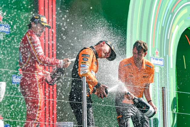 25th August 2024; Circuit Zandvoort, Zandvoort, North Holland, Netherlands; Formula 1 Heineken Dutch Grand Prix 2024; Race Day; Winner Lando Norris (GBR) is sprayed with champagne by Charles Leclerc (MON) who finished third and Will Joseph, Director, Race Engineering at McLaren  ActionPlus12686041 GodfreyxPitt
