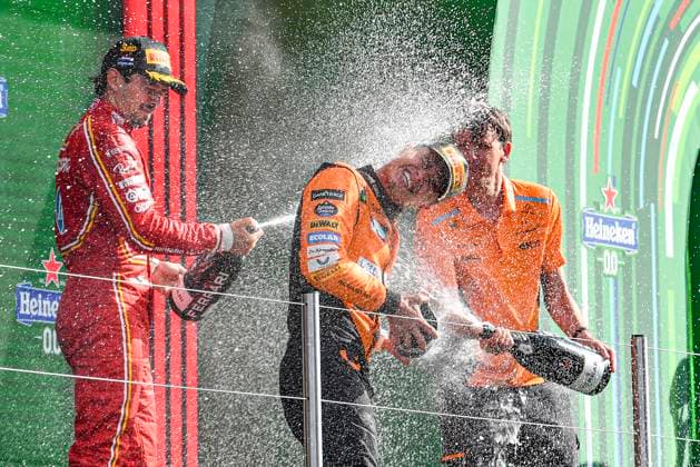 25th August 2024; Circuit Zandvoort, Zandvoort, North Holland, Netherlands; Formula 1 Heineken Dutch Grand Prix 2024; Race Day; Winner Lando Norris (GBR) is sprayed with champagne by Charles Leclerc (MON) who finished third and Will Joseph, Director, Race Engineering at McLaren  ActionPlus12686042 GodfreyxPitt