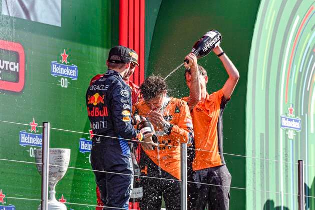 25th August 2024; Circuit Zandvoort, Zandvoort, North Holland, Netherlands; Formula 1 Heineken Dutch Grand Prix 2024; Race Day; Winner Lando Norris (GBR) is sprayed with champagne by Charles Leclerc (MON) who finished third and Will Joseph, Director, Race Engineering at McLaren  ActionPlus12686044 GodfreyxPitt