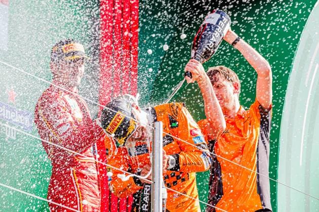 Lando Norris GBR, McLaren with his race engineer William Joseph and Charles Leclerc MON, Scuderia Ferrari, left in the picture Award Ceremony Winner, first place, gold medal, gold medal cheers, celebration champagne shower, 25 08 2024, Zandvoort Netherlands, Motorsport, Formula 1, Grand Prix of the Netherlands 2024 xprx