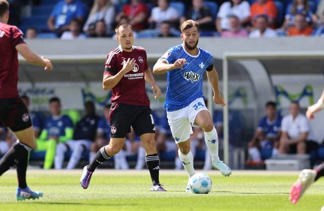 25 08 2024, xdcx, Soccer 2 Bundesliga, SV Darmstadt 98 1 FC Nürnberg, emonline, emspor, despor, v l , Julian Justvan 1 FC Nürnberg , Killian Corredor SV Darmstadt 98 DFL DFB REGULATIONS PROHIBIT ANY USE OF PHOTOGRAPHS AS IMAGE SEQUENCES AND OR QUASI VIDEO Copyright: HMBxMedia Claus
