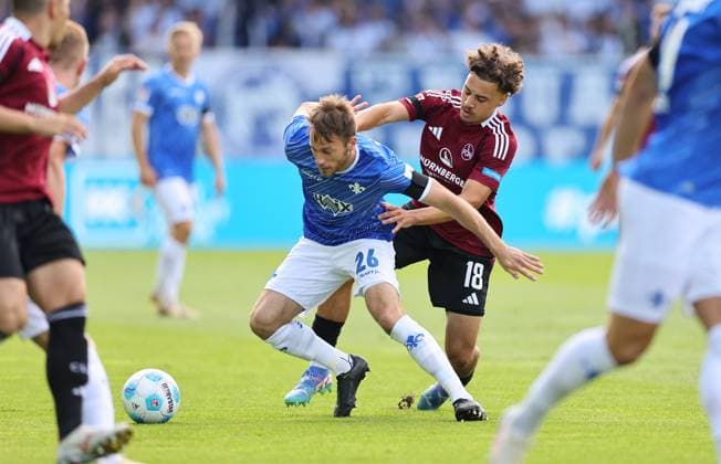 25 08 2024, xdcx, Soccer 2 Bundesliga, SV Darmstadt 98 1 FC Nürnberg, emonline, emspor, despor, v l , Matthias Bader SV Darmstadt 98 , Rafael Lubach 1 FC Nürnberg DFL DFB REGULATIONS PROHIBIT ANY USE OF PHOTOGRAPHS AS IMAGE SEQUENCES AND OR QUASI VIDEO Copyright: HMBxMedia Claus