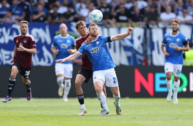 25 08 2024, xdcx, Soccer 2 Bundesliga, SV Darmstadt 98 1 FC Nürnberg, emonline, emspor, despor, v l , Michal Sevcik 1 FC Nürnberg , Paul Will SV Darmstadt 98 DFL DFB REGULATIONS PROHIBIT ANY USE OF PHOTOGRAPHS AS IMAGE SEQUENCES AND OR QUASI VIDEO Copyright: HMBxMedia Claus